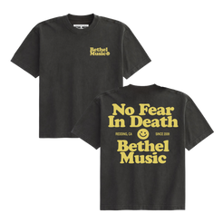 Black t-shirt with yellow text and Bethel logo on a white background