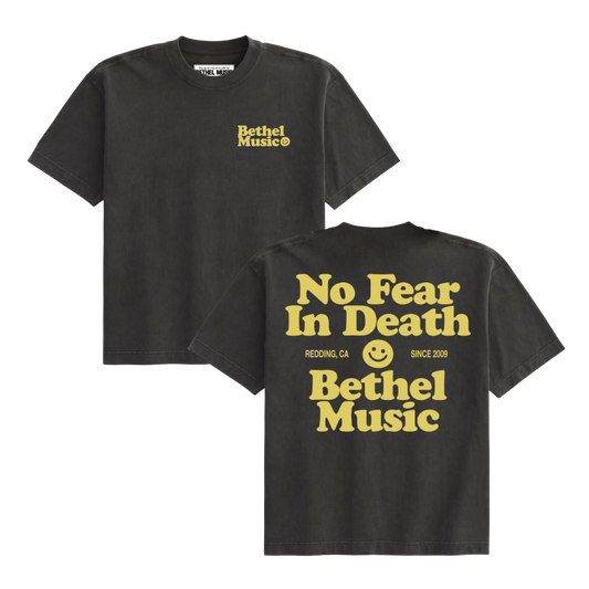 Black t-shirt with yellow text and Bethel logo on a white background