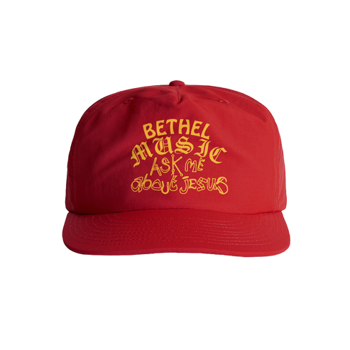 Red cap with yellow text